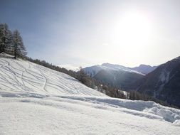 snowy slopes in the alps on a sunny day