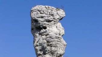 oblong rock against the blue sky