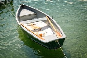 rowing boat is moored at the lake