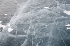 winter frozen field with transparent ice
