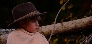 Girl near the tree at dusk