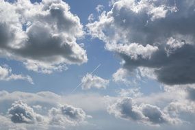 plane trail in the blue sky