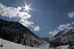 Beautiful sunny alpine mountain landscape with snow in winter in Austria