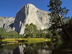 lake at the foot of a cliff in california