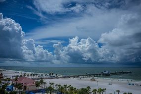 clearwater beach with fluffy clouds