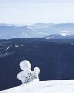 Beautiful snowy mountain landscape with the snowman in British Columbia, Canada