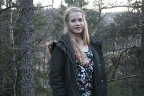 blonde girl portrait in the forest