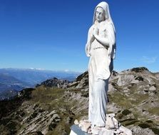 Beautiful statue of Madonna on Small Dolomites in Italy