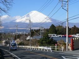 power line along the road against the background of a high mountain in Japan