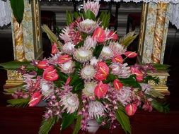 Beautiful and colorful flower arrangement near the decorated fireplace on Madeira, Portugal