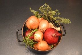 onion, thyme, rosemary and garlic in a saucepan