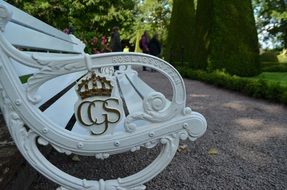 white garden bench in the royal garden