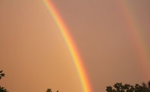 bright colorful rainbow in the gray sky