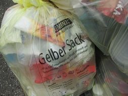 Yellow bag with plastic bottles