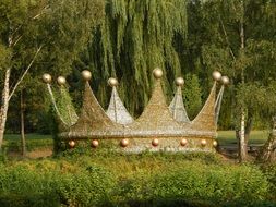 huge crown on the grass as a decoration in the park