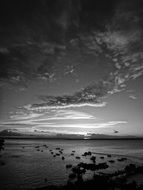 black and white photo of sunset over the lake