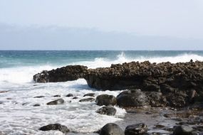 surf on the rocks on the island of lanzarote