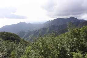 panoramic view of green mountains in tenerife on a sunny day