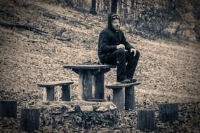 man resting in an autumn park