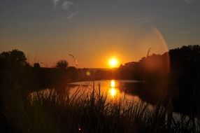 golden sun over countryside at sunset in France