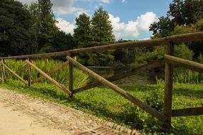 wooden fence along the lake shore