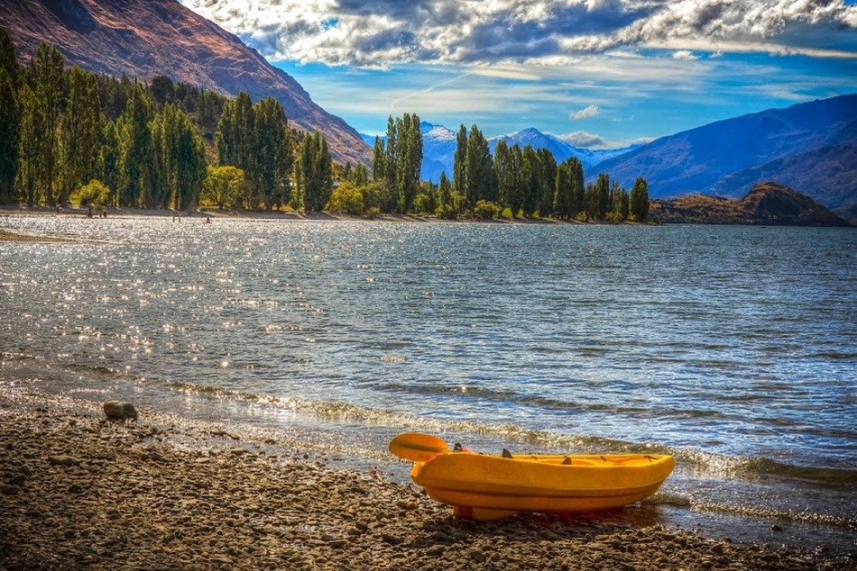 yellow boat by the lake wanaka
