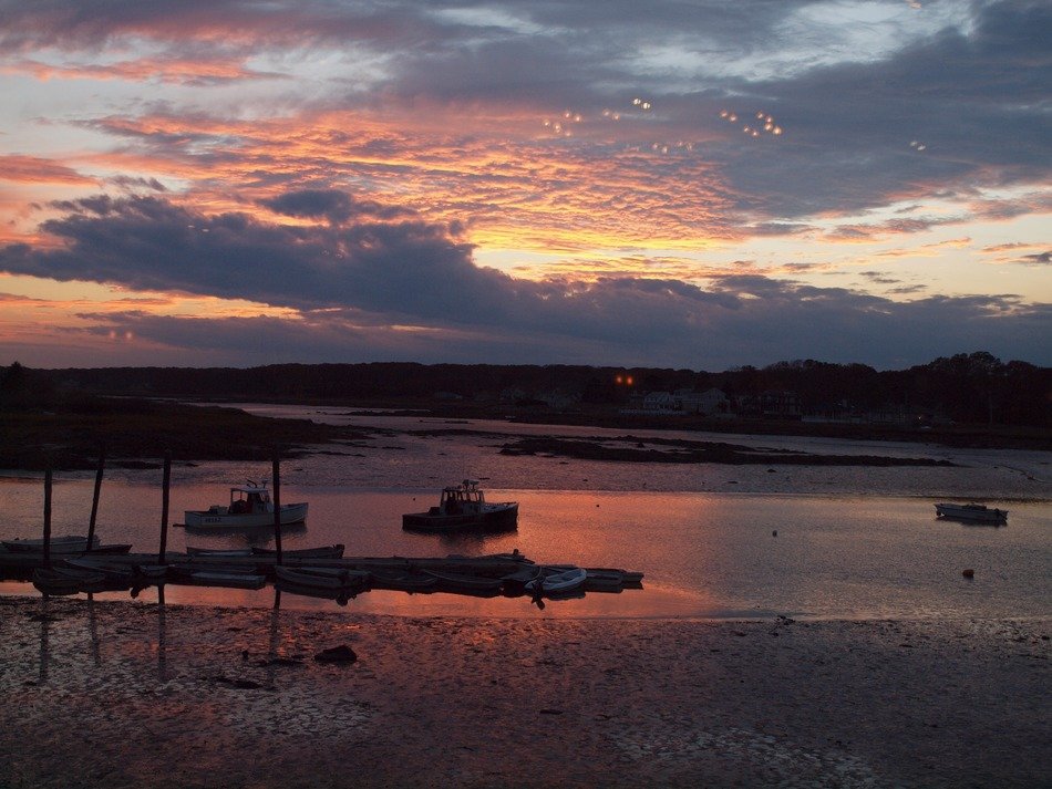 sunset on the background of boats in the ocean