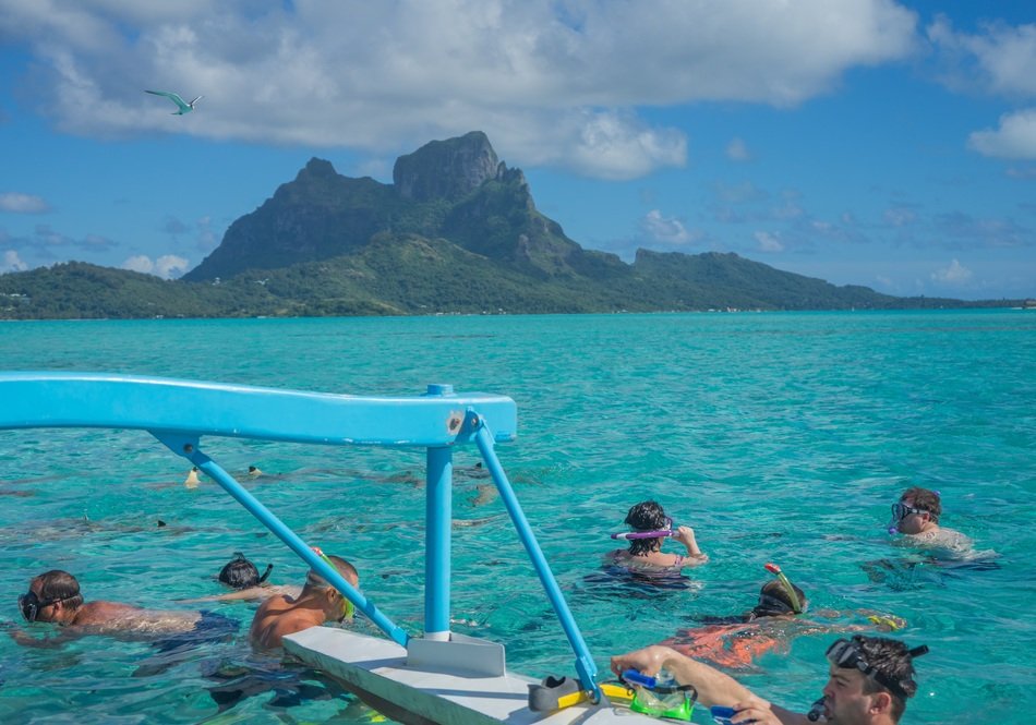 people swimming bora french polynesia ocean