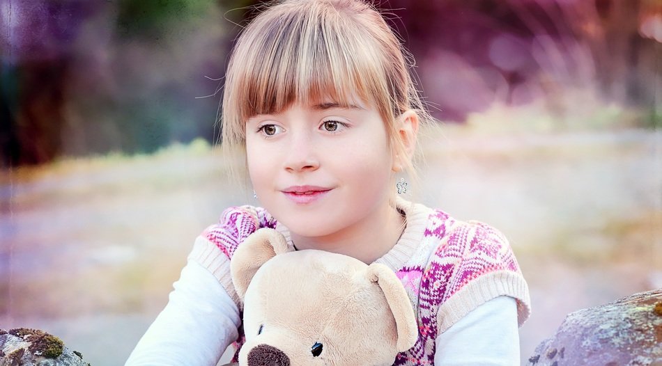 cute blond girl with teddy bear