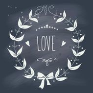 Valentine&#039;s Day wreath with text on blackboard N4