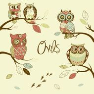 owls sitting on the branches