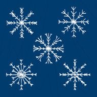 Set of five drawn snowflakes on blue background