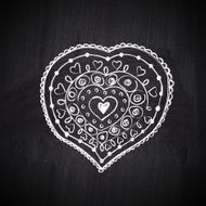 Heart shape chalk drawing on chalkboard