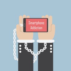 Businessman hands with smartphone and shackle Smartphone addiction concept