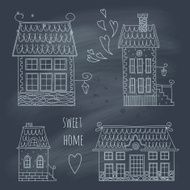 Hand drawn set of cute retro houses on blackboard