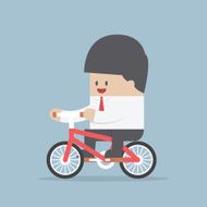 Businessman riding a bicycle to work