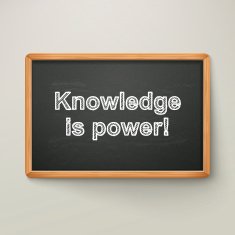 knowledge is power on blackboard in wooden frame