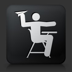 Black Square Button with Misbehaving on School Desk