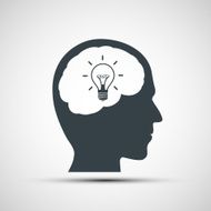 Vector icon of human head with a light bulb