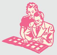Man and Woman Looking at Photo Album