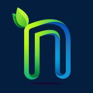 N letter with green leaves and water waves