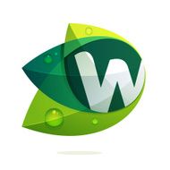 W letter with green leaves and dew drops