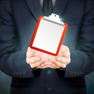 businessman holding a clipboard