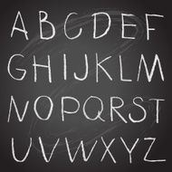 Chalk hand drawing alphabet on a blackboard