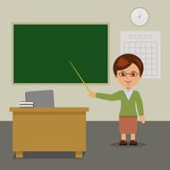 The teacher stands at the blackboard in class