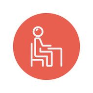 Student sitting on a chair in front of his table N2