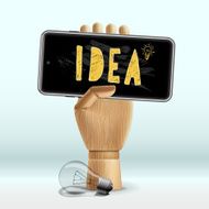 Idea concept Wooden human hand with mobile phone