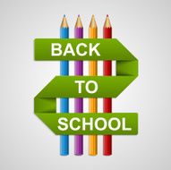 Colorful pencils with text back to school on paper ribbon