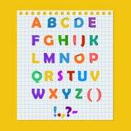Complete colorful paper alphabet on a yellow