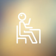 Student sitting on a chair in front of his table N3
